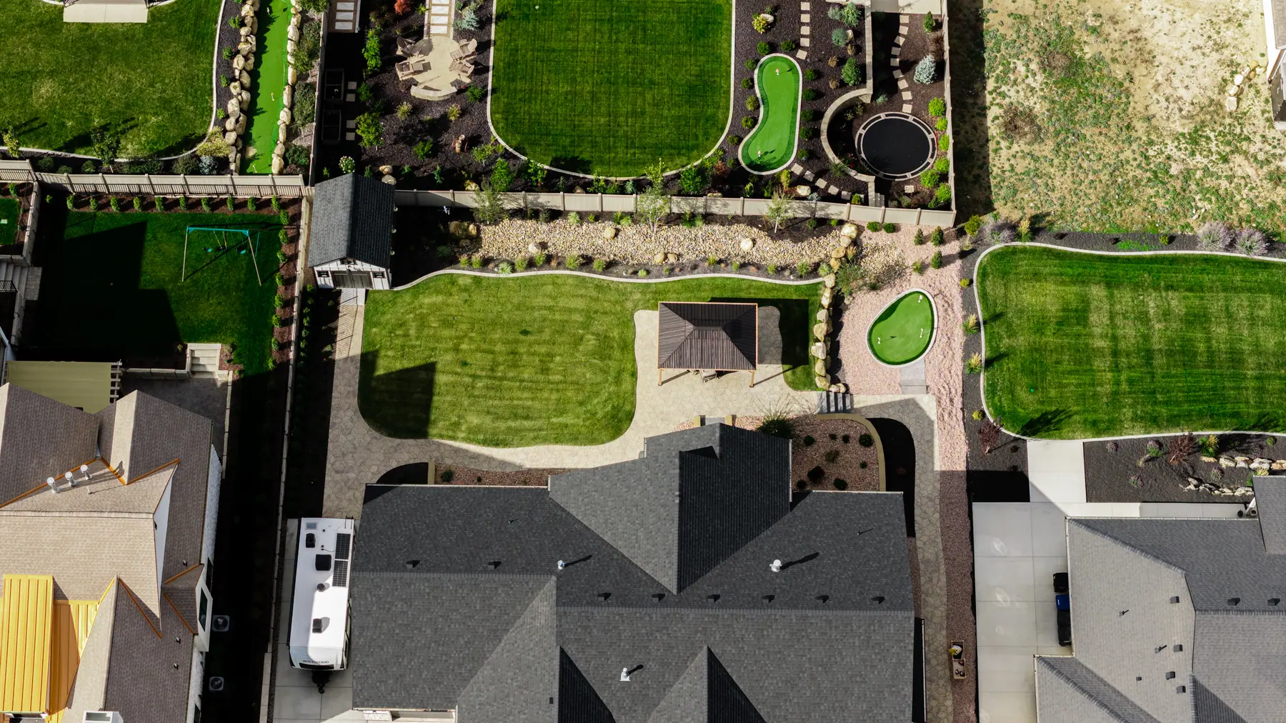 Backyard putting greens from above by J&H Landscaping in Utah County
