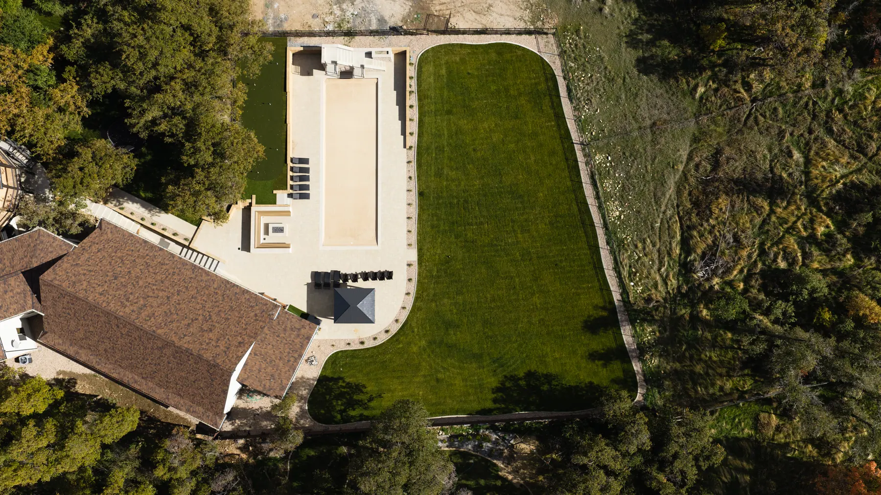 Patio and lawn from overhead by J&H Landscaping in Utah County