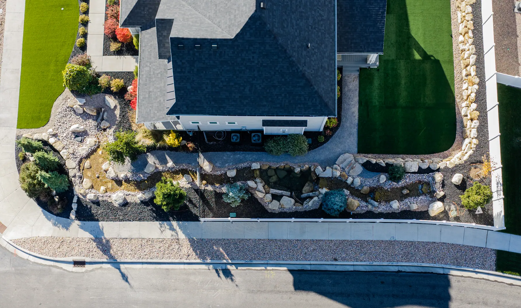 Boulder garden along the street by J&H Landscaping in American Fork