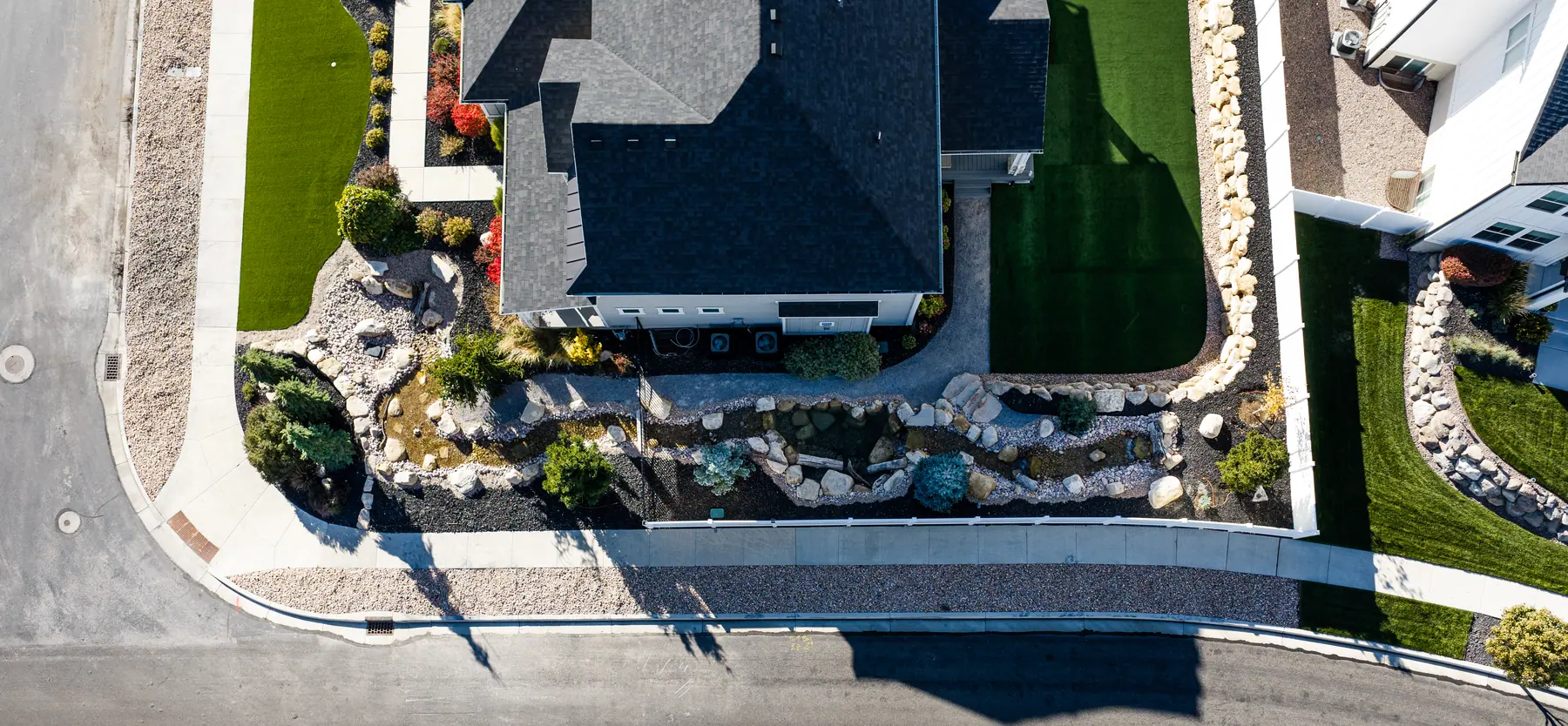 Dry creek bed and plantings by J&H Landscaping in American Fork
