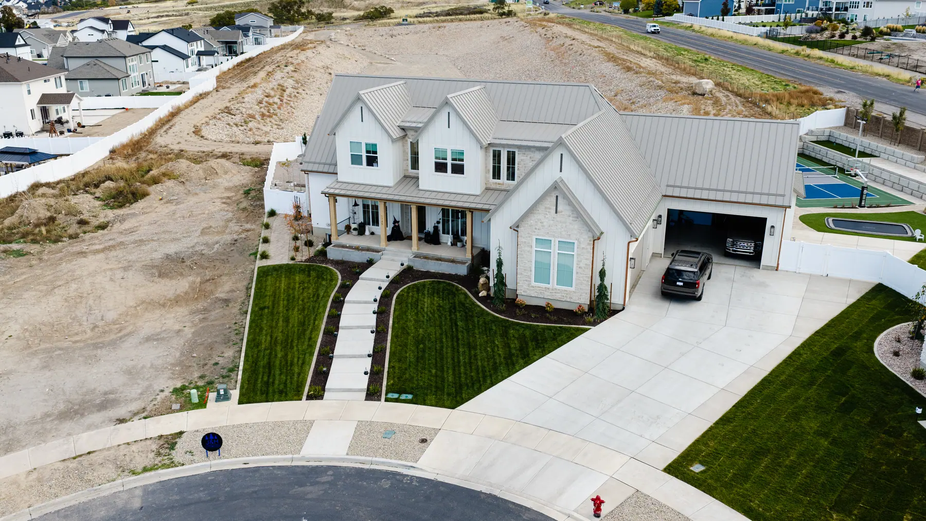 New-build front yard on a cul-de-sac by J&H Landscaping in Utah County