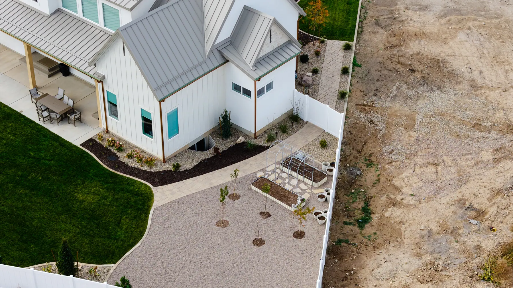 Rock yard and garden beds by J&H Landscaping in Utah County