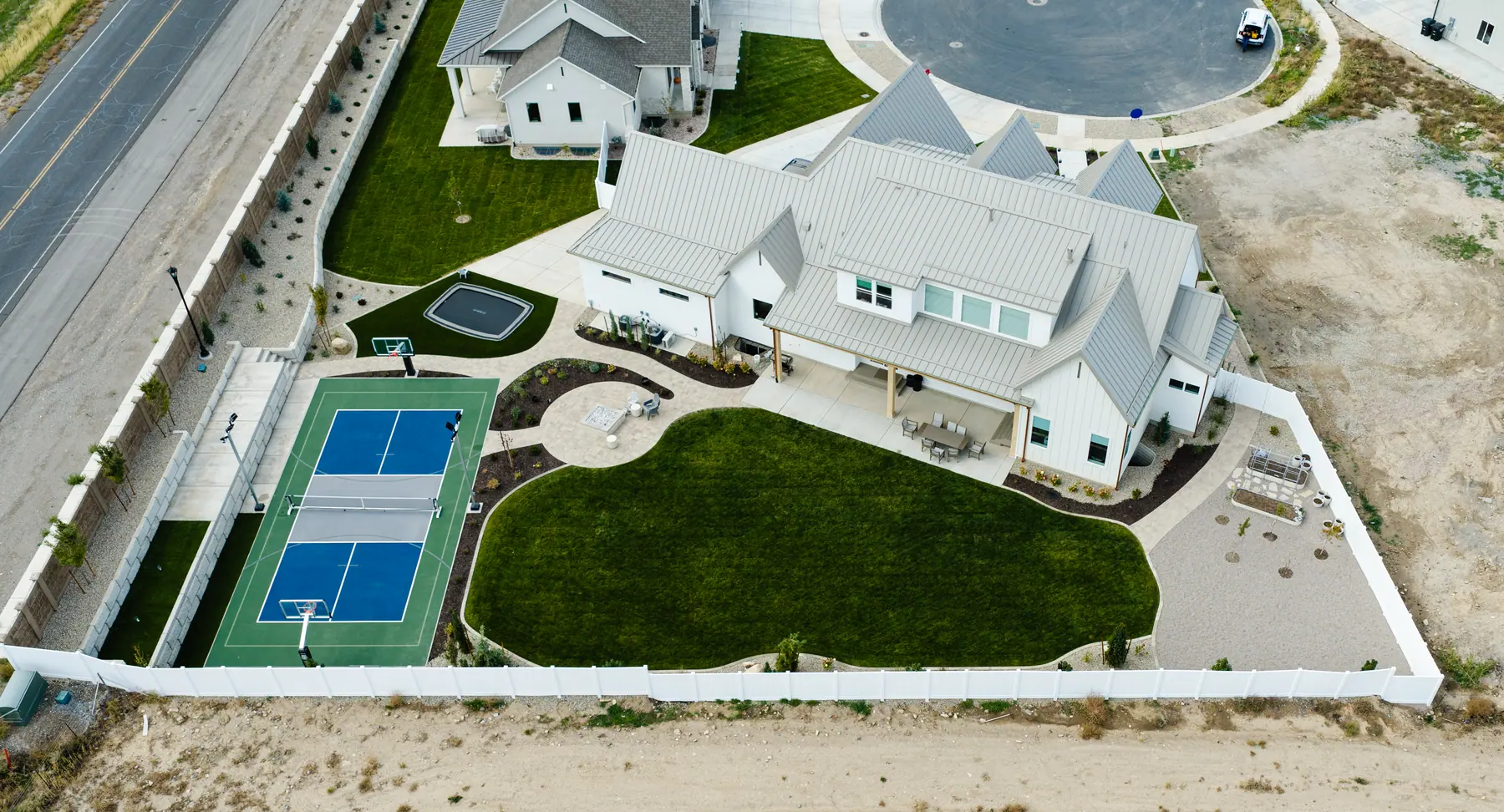 Pickleball court and lawn by J&H Landscaping in Utah County