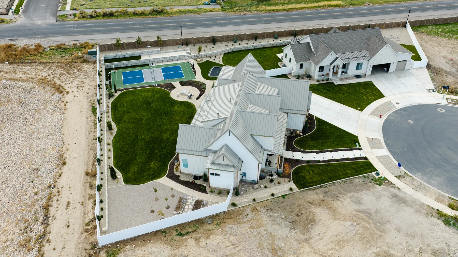 Full yard with a pickleball court by J&H Landscaping in Utah County