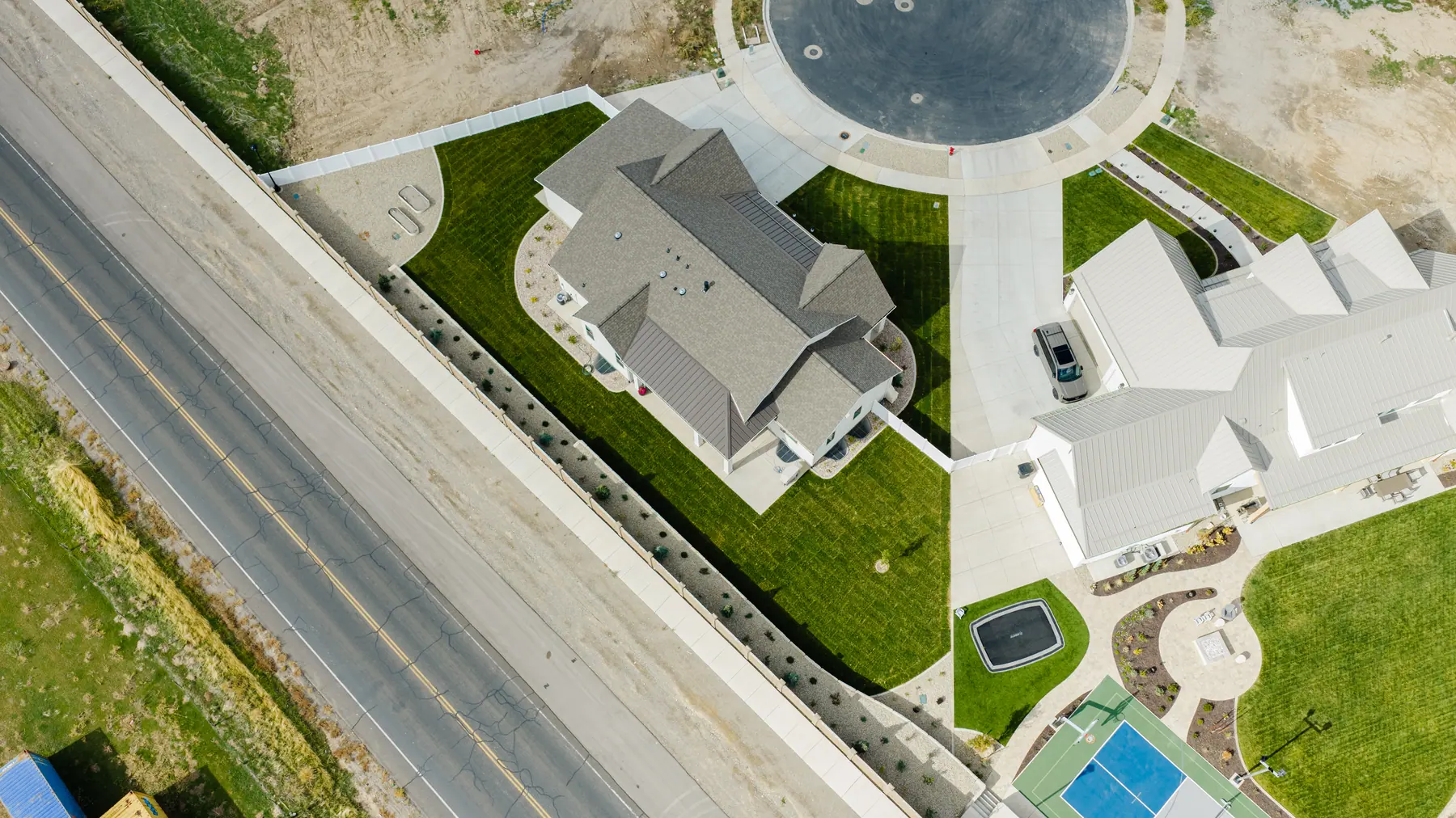 Lawn and court from above by J&H Landscaping in Utah County