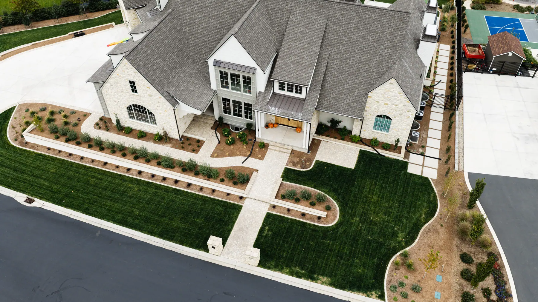 Front lawn and walkway by J&H Landscaping in Mapleton