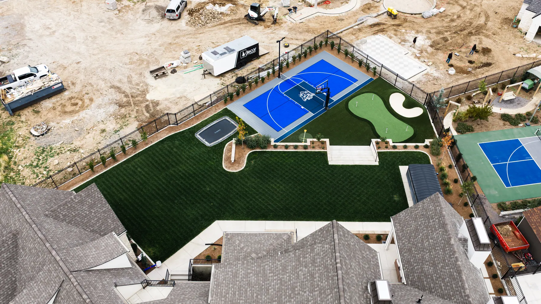 Sport court and putting green by J&H Landscaping in Mapleton