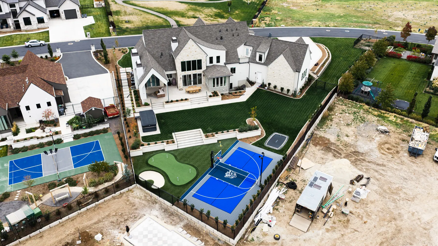 Sport court and putting green by J&H Landscaping in Mapleton