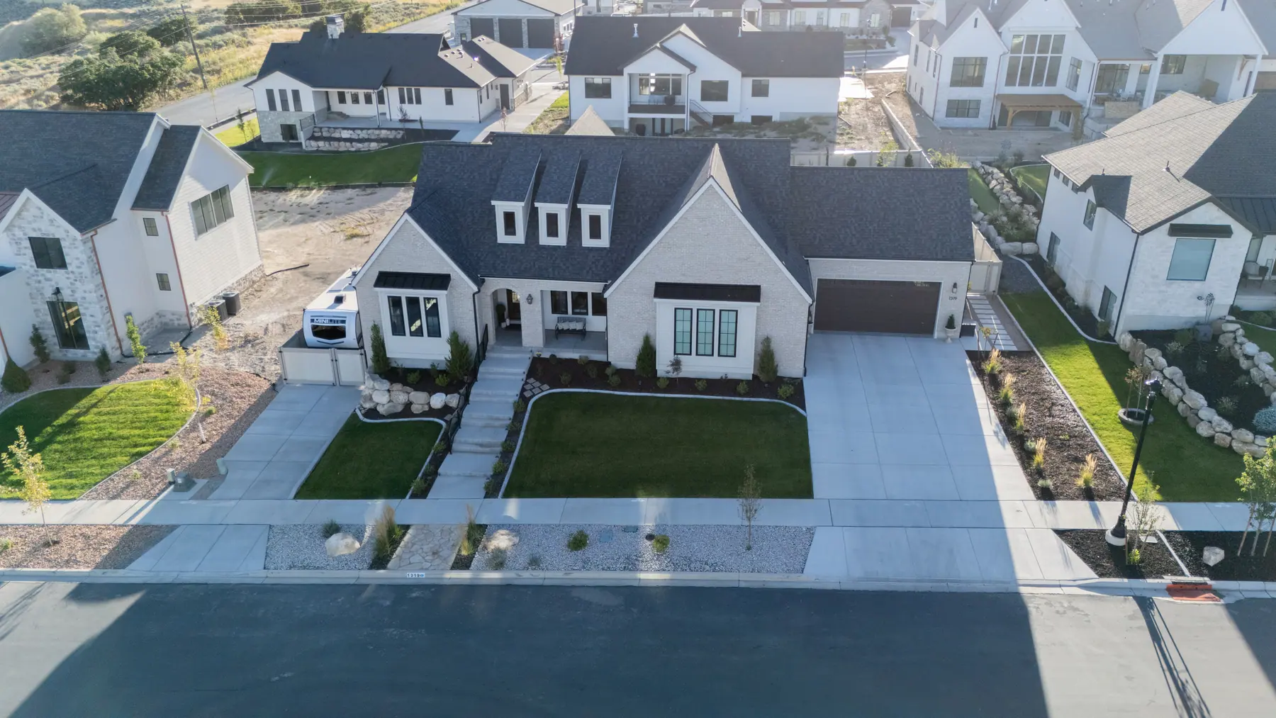 Front yard at dusk by J&H Landscaping in Salem