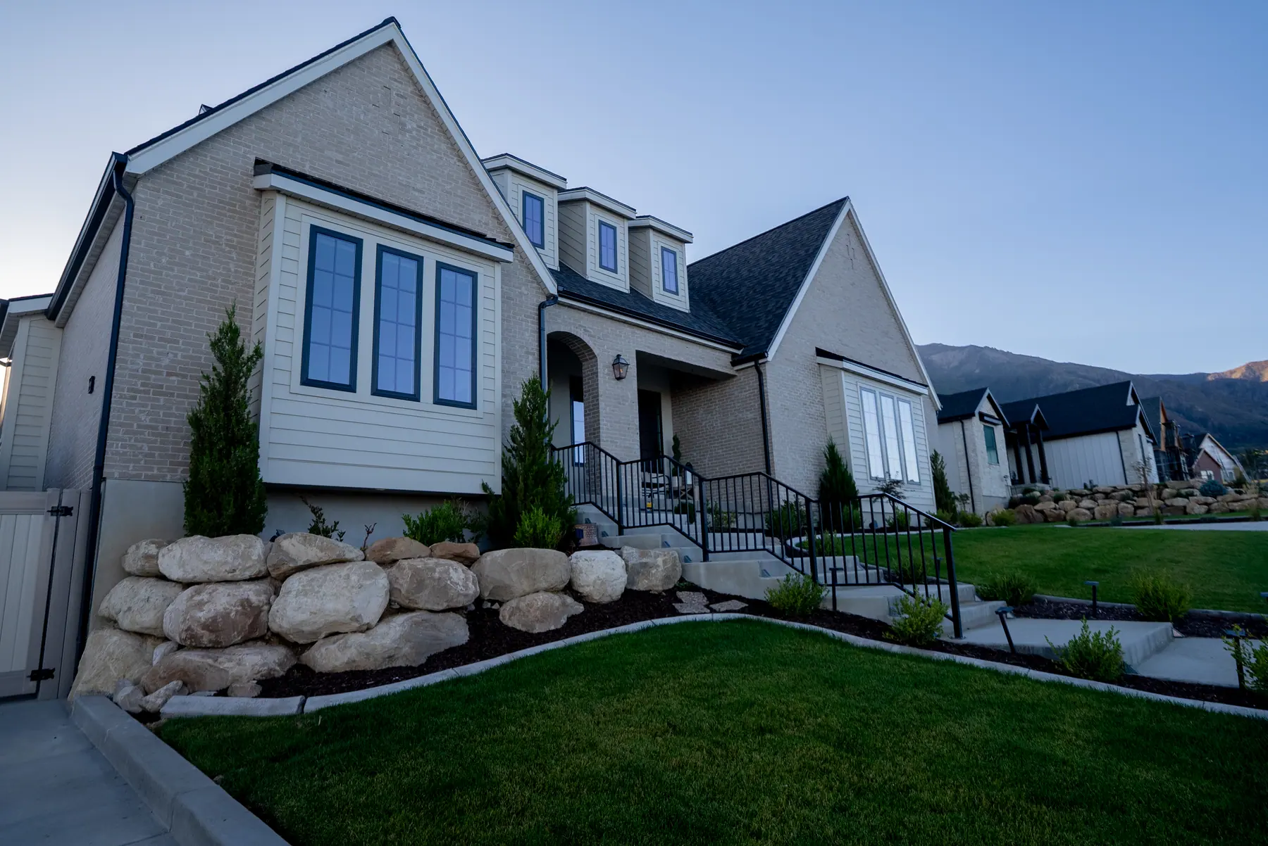 Boulders and ornamental grass by J&H Landscaping in Salem