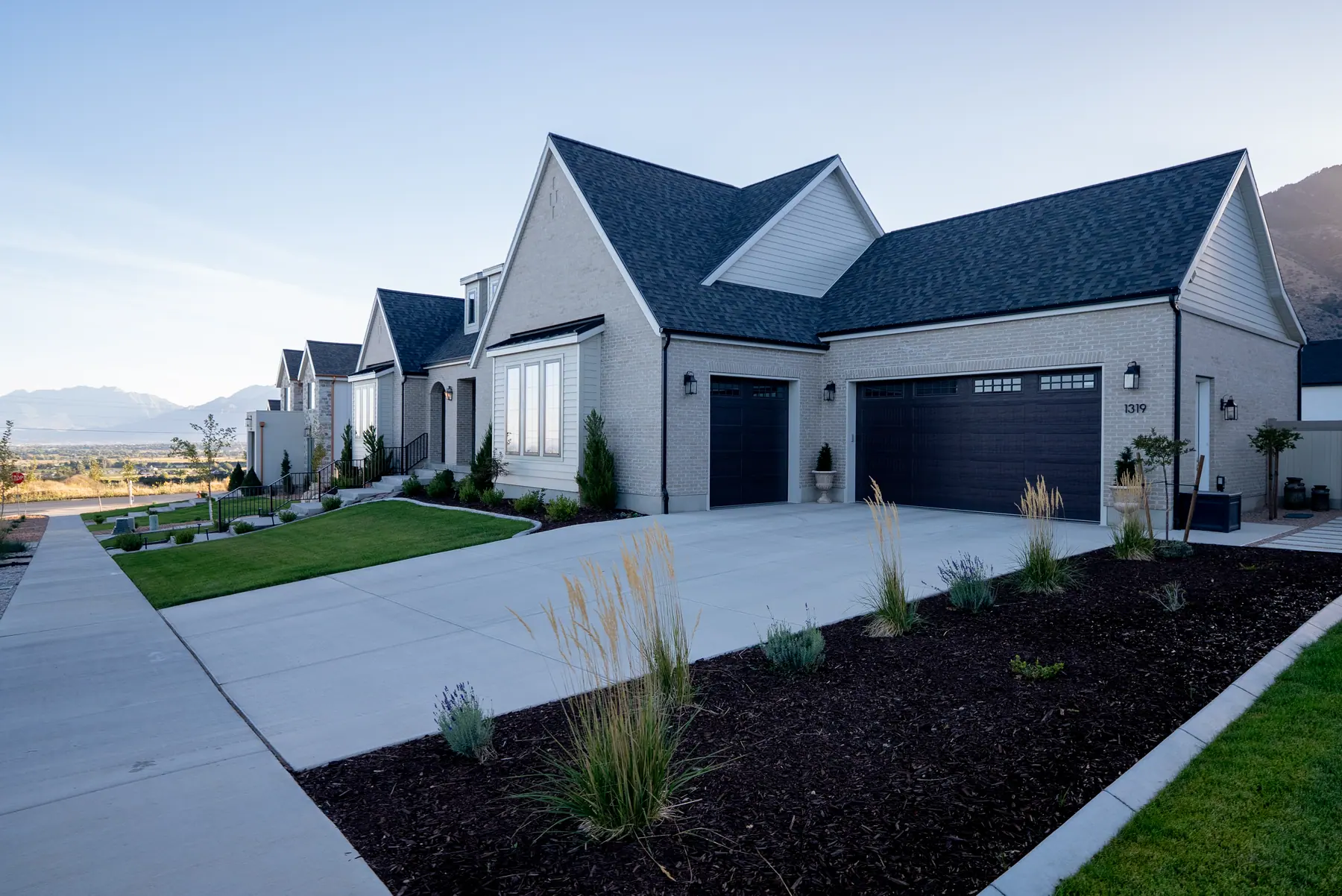 Front yard and driveway beds by J&H Landscaping in Salem