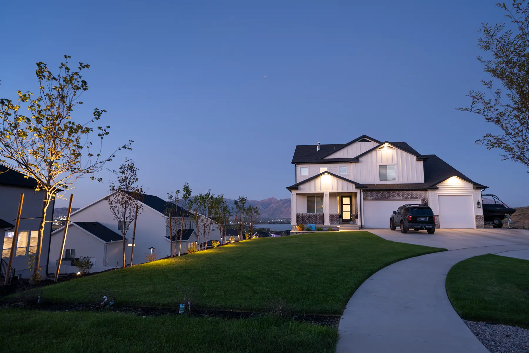 Front lawn at dusk by J&H Landscaping in Saratoga Springs
