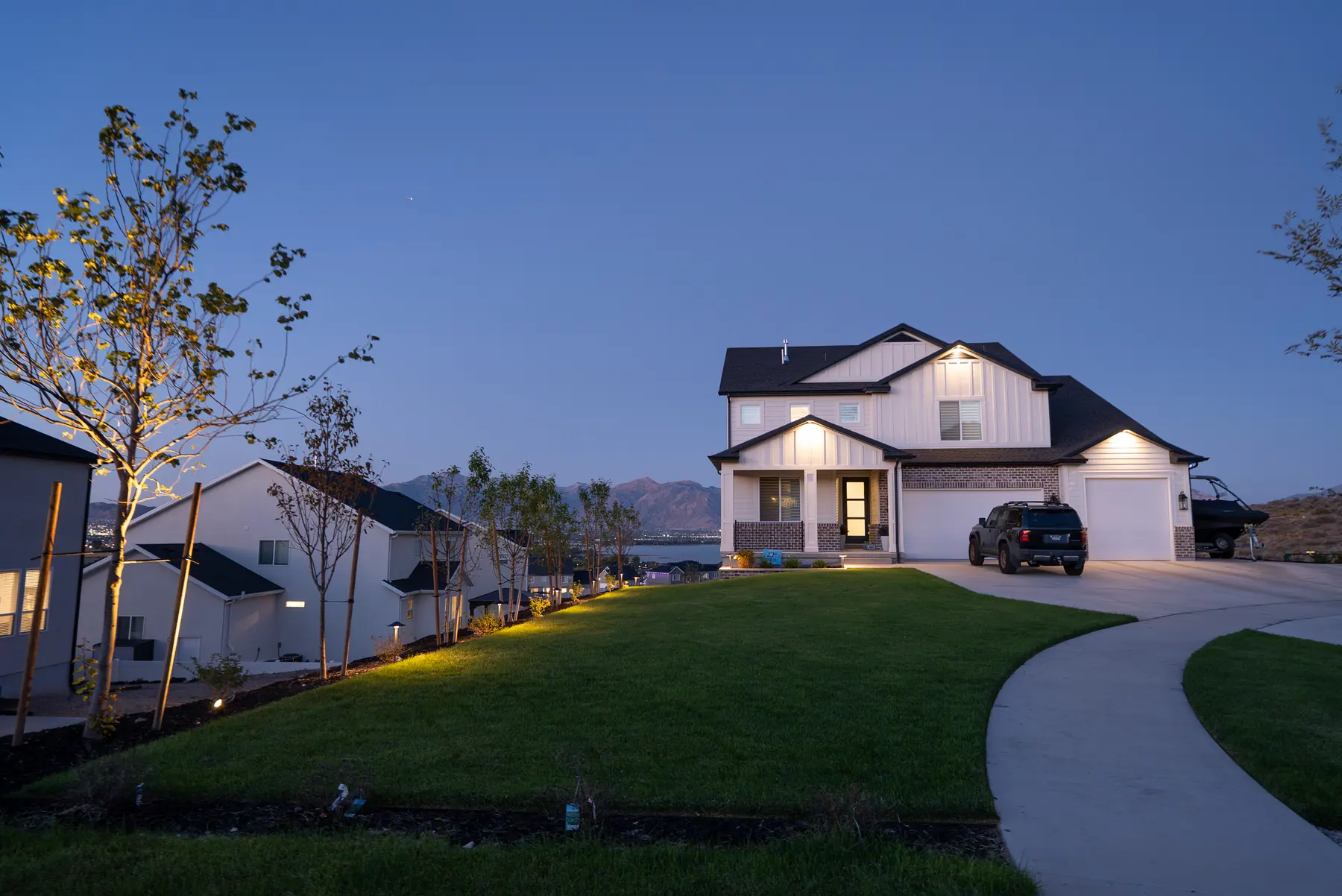 Front lawn at dusk by J&H Landscaping in Saratoga Springs