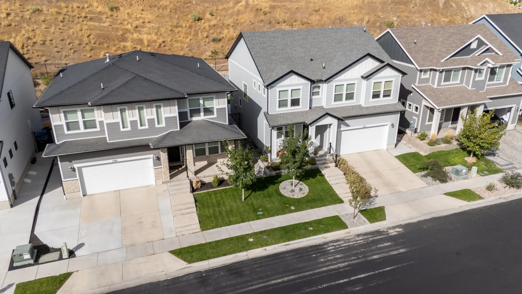 New-build front yards by J&H Landscaping in Lehi