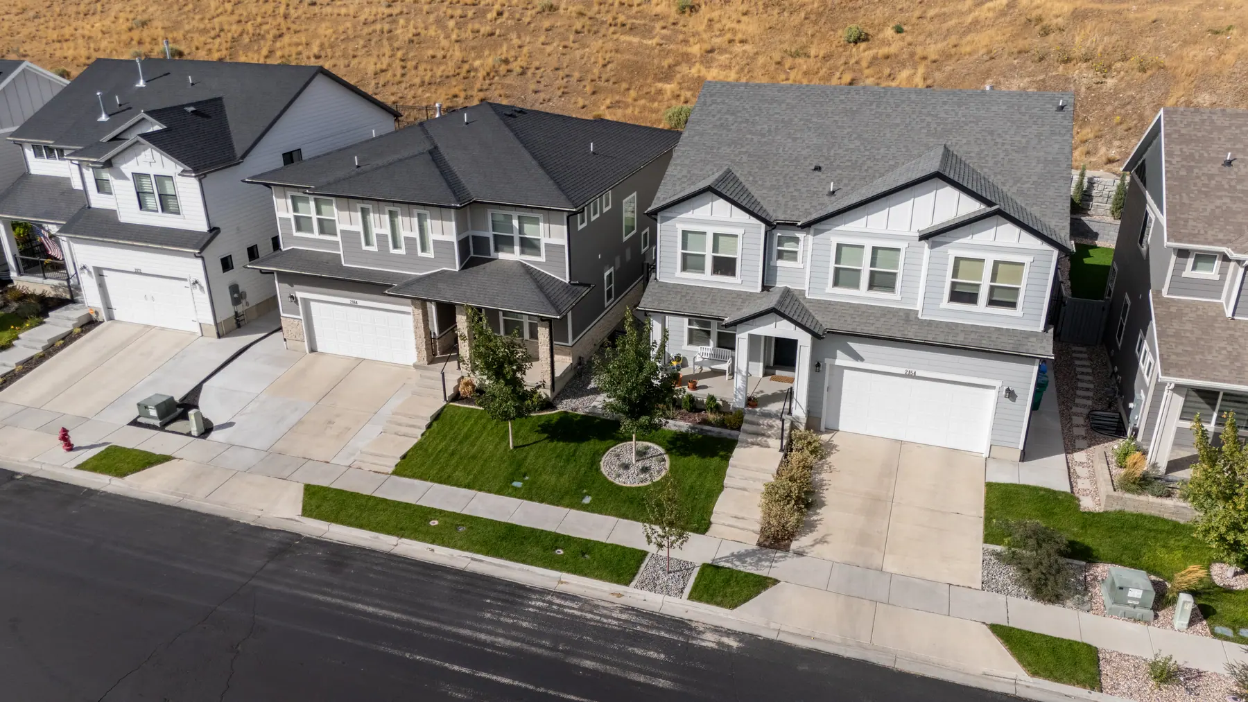 New-build front yards from above by J&H Landscaping in Lehi