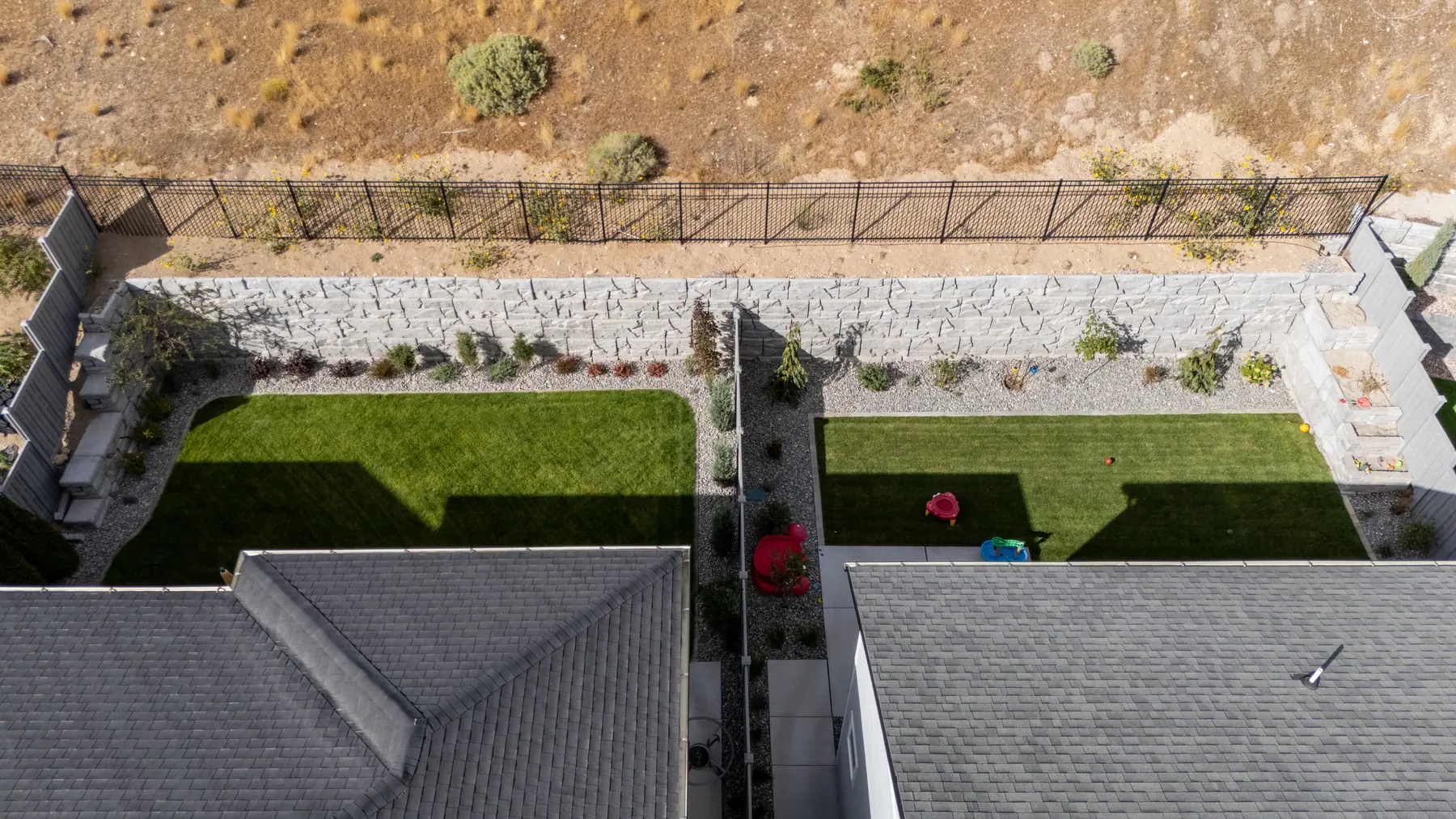 Side yard planting below the hill by J&H Landscaping in Lehi