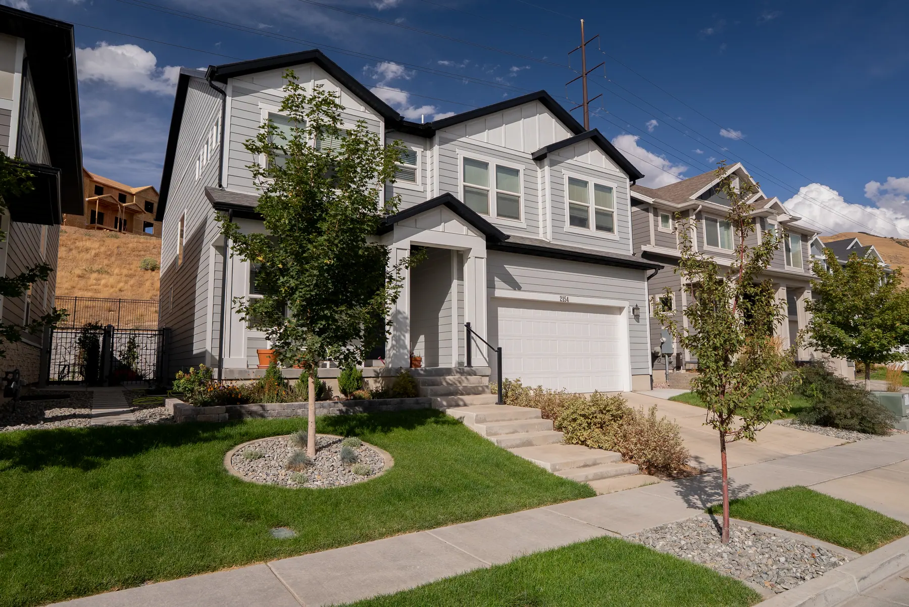 Front lawn and rock border by J&H Landscaping in Lehi