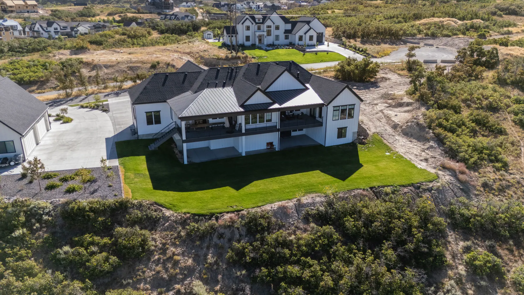 Hillside lot from above by J&H Landscaping in Mapleton