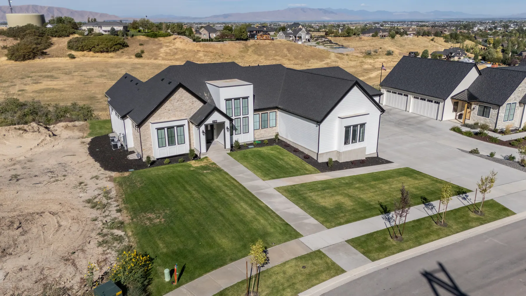 Front yard on a foothill lot by J&H Landscaping in Mapleton