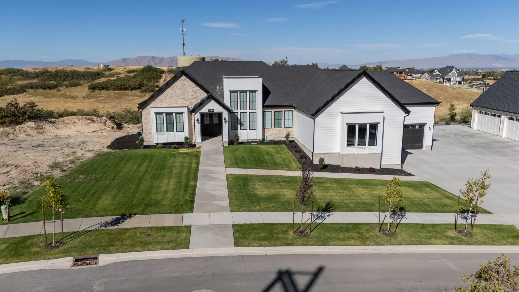 Front yard on a foothill lot by J&H Landscaping in Mapleton
