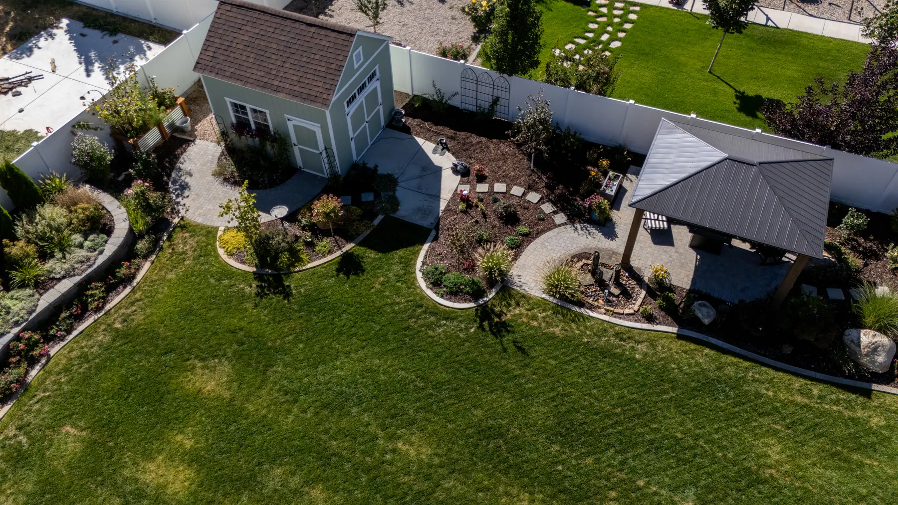 Pavilion, paths and beds by J&H Landscaping in Mapleton