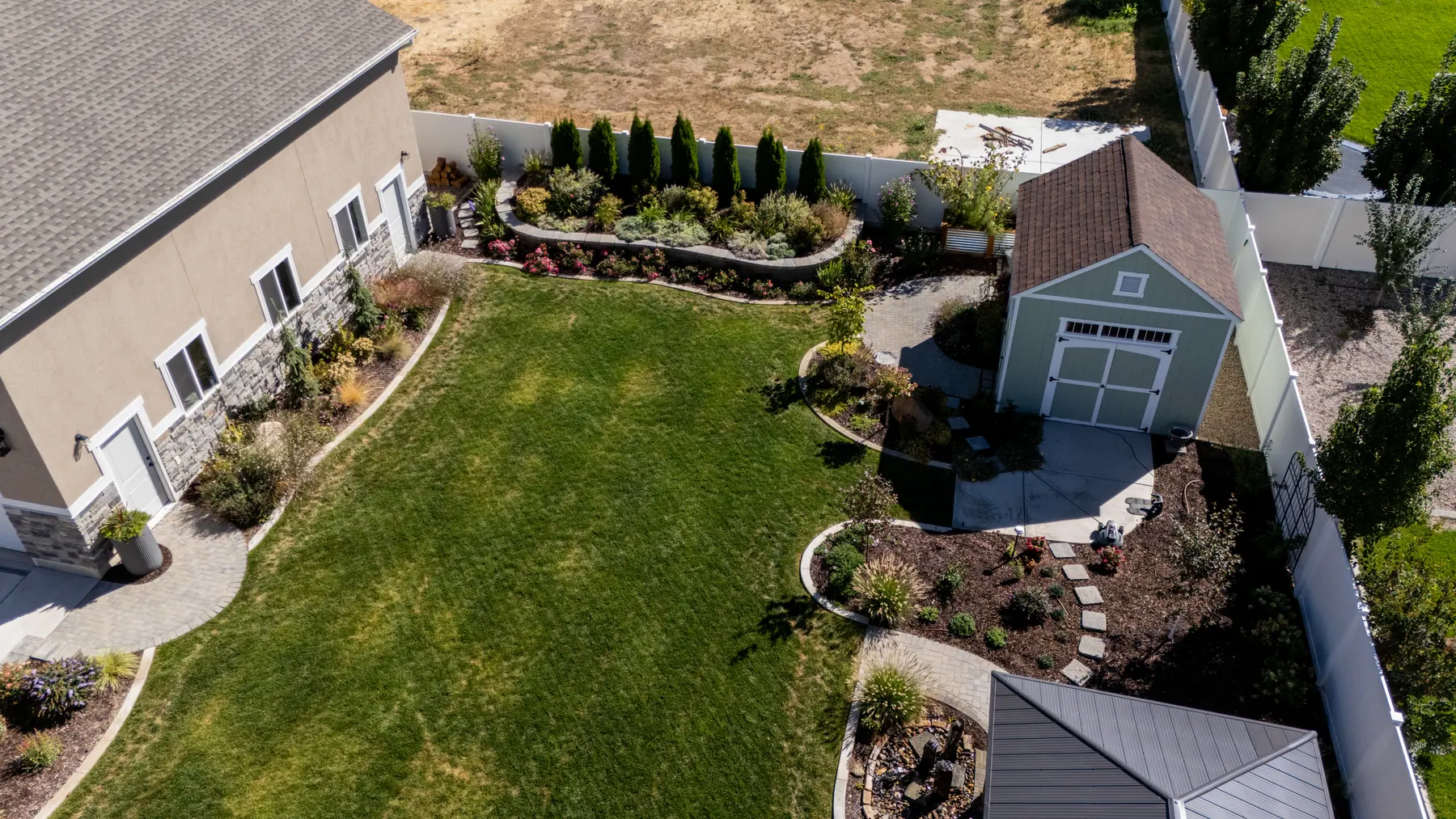 Lawn, shed and garden paths by J&H Landscaping in Mapleton