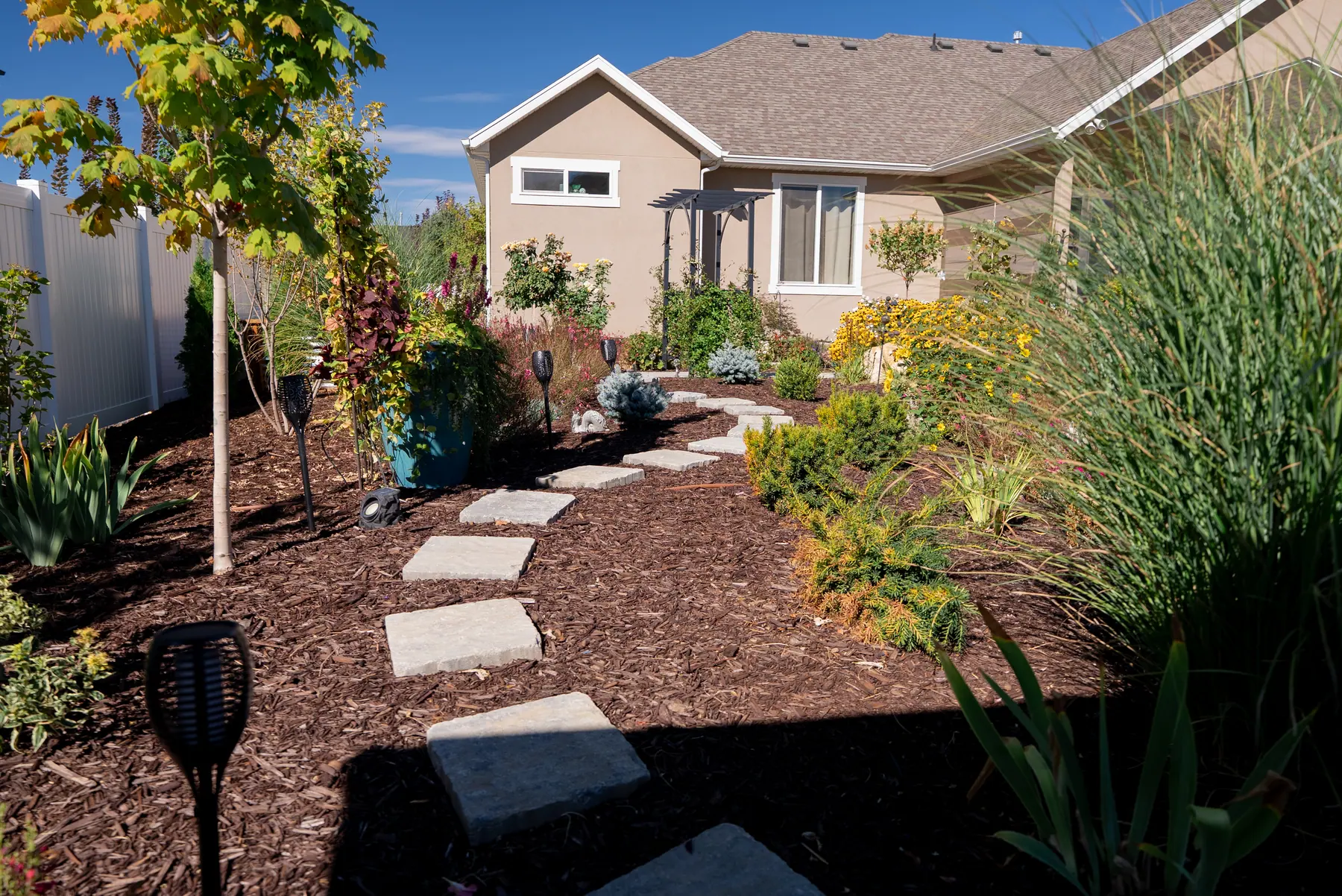 Stepping-stone garden path by J&H Landscaping in Mapleton