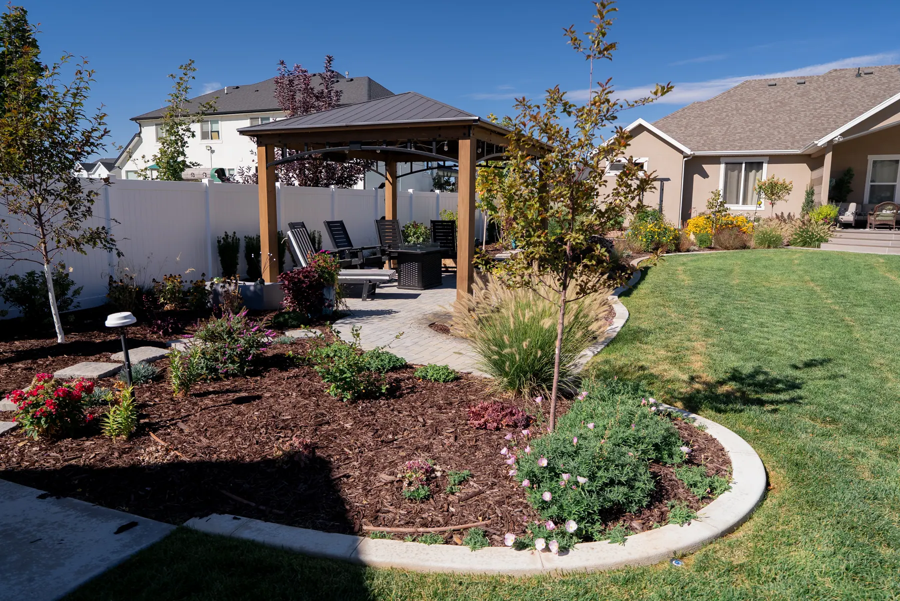 Pavilion and flower beds by J&H Landscaping in Mapleton