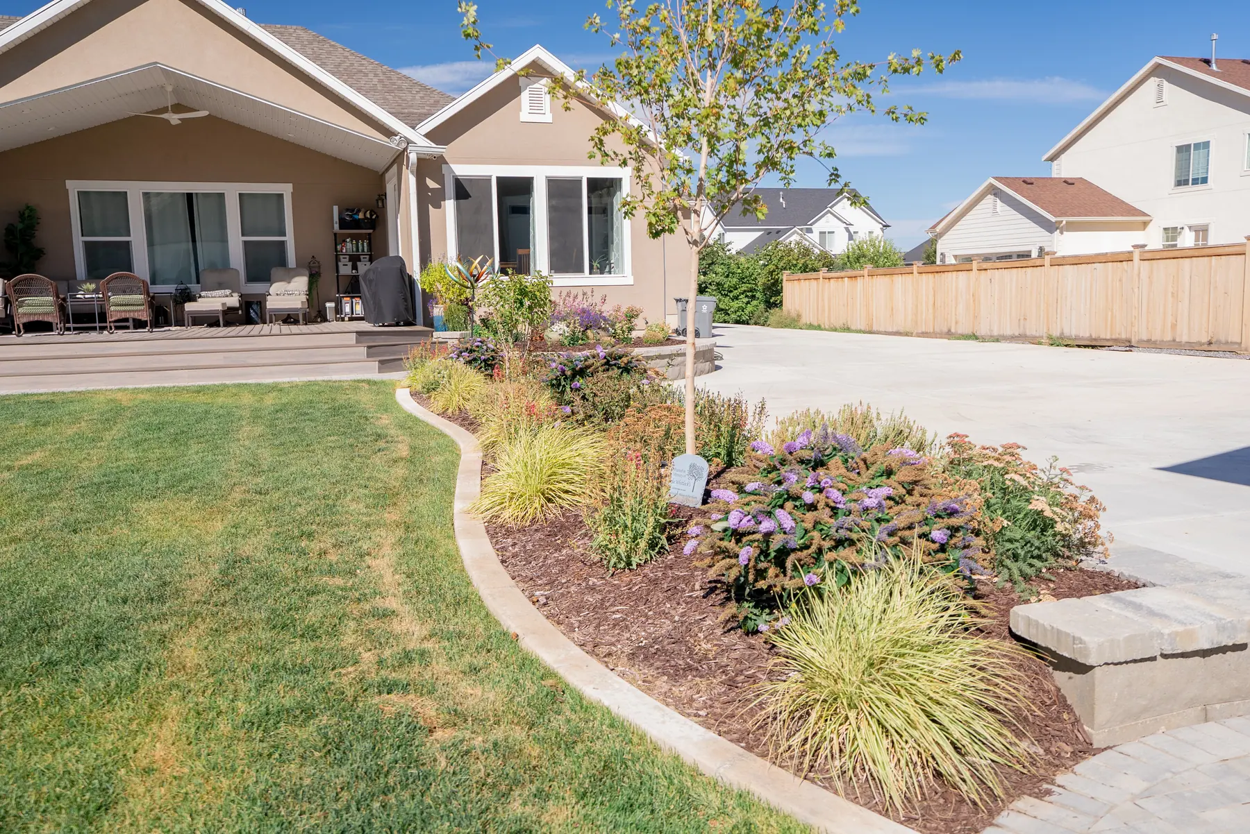 Curved beds and lawn by J&H Landscaping in Mapleton