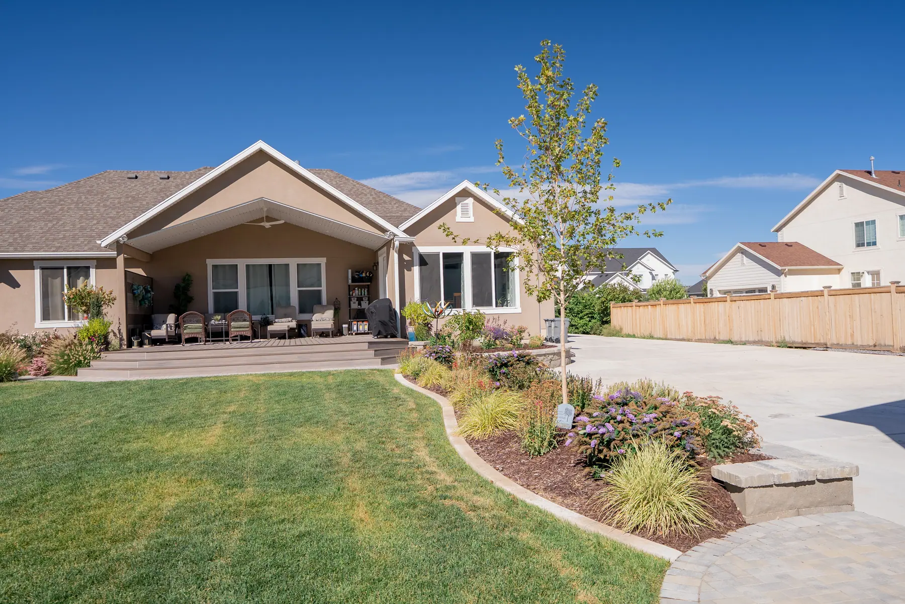Patio and planted borders by J&H Landscaping in Mapleton