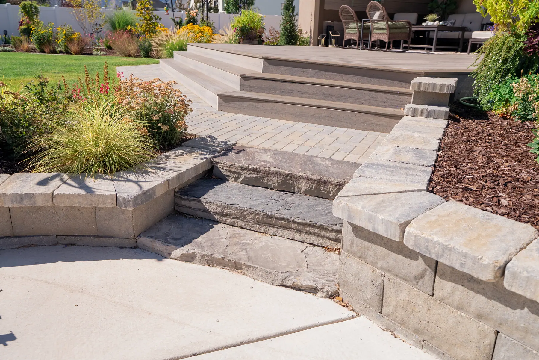 Paver steps and seat wall by J&H Landscaping in Mapleton