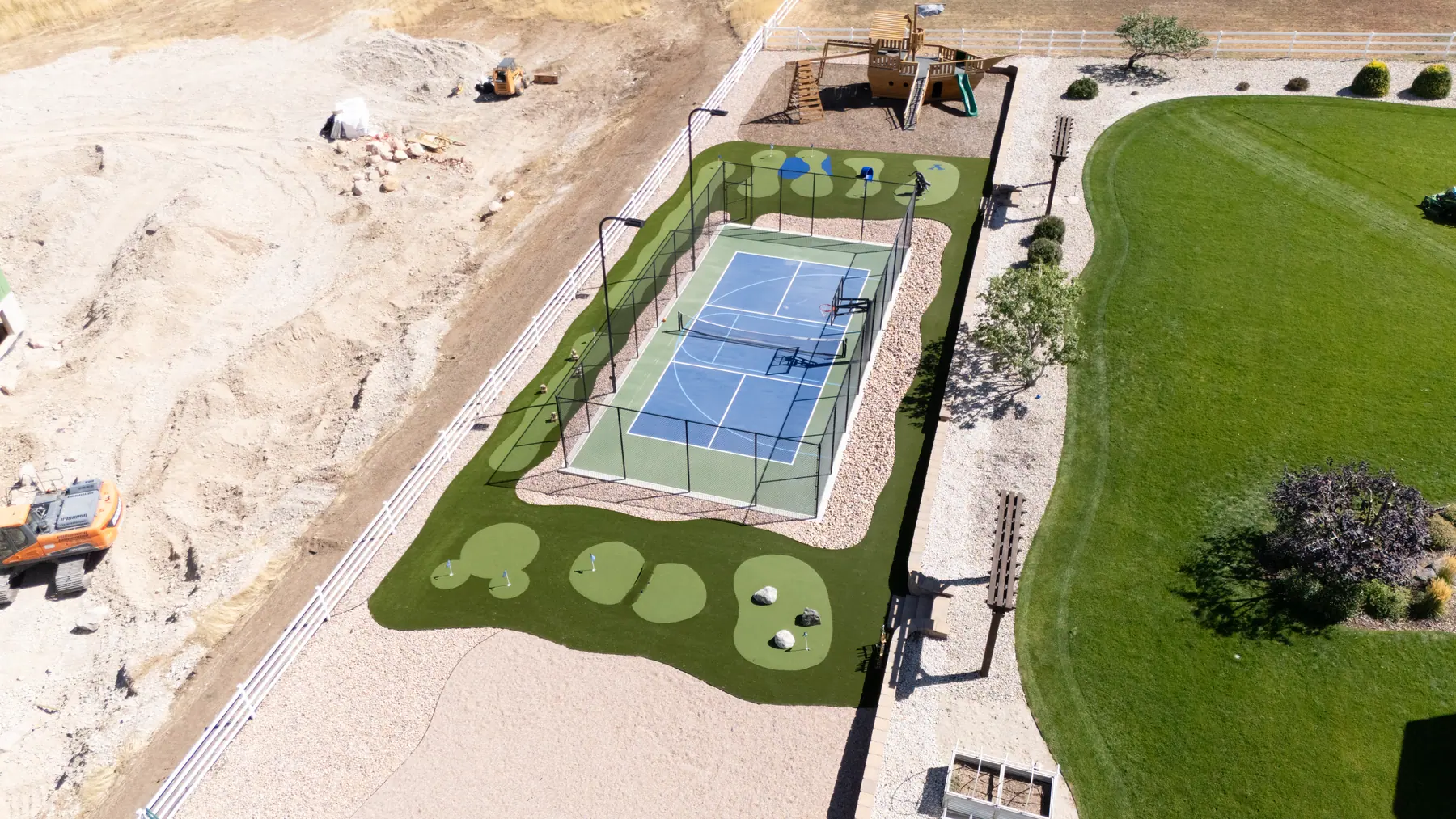 Court, turf and play area by J&H Landscaping in Elk Ridge