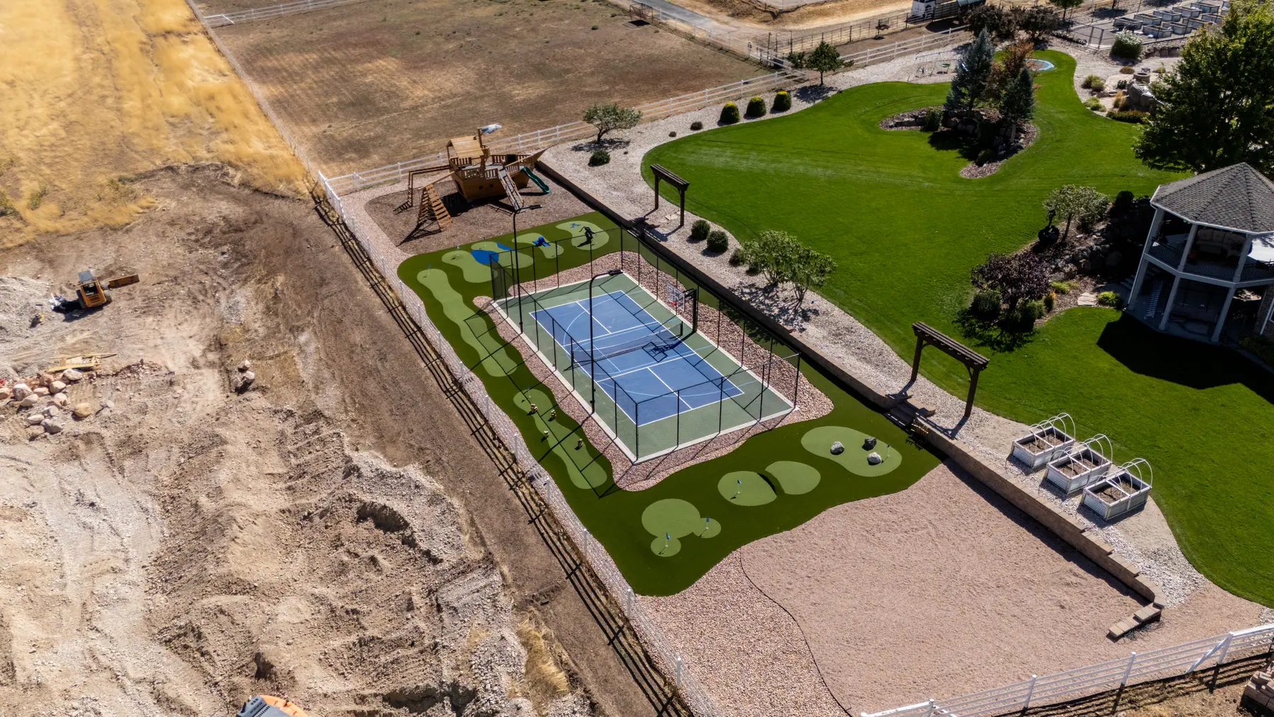 Court and putting course from above by J&H Landscaping in Elk Ridge