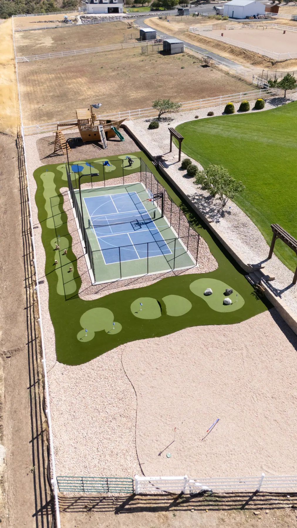 Court and turf course from above by J&H Landscaping in Elk Ridge