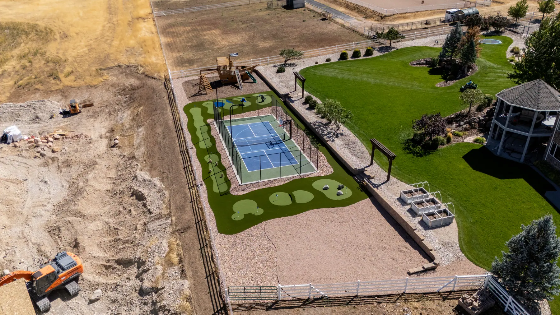 Court, turf and play area by J&H Landscaping in Elk Ridge