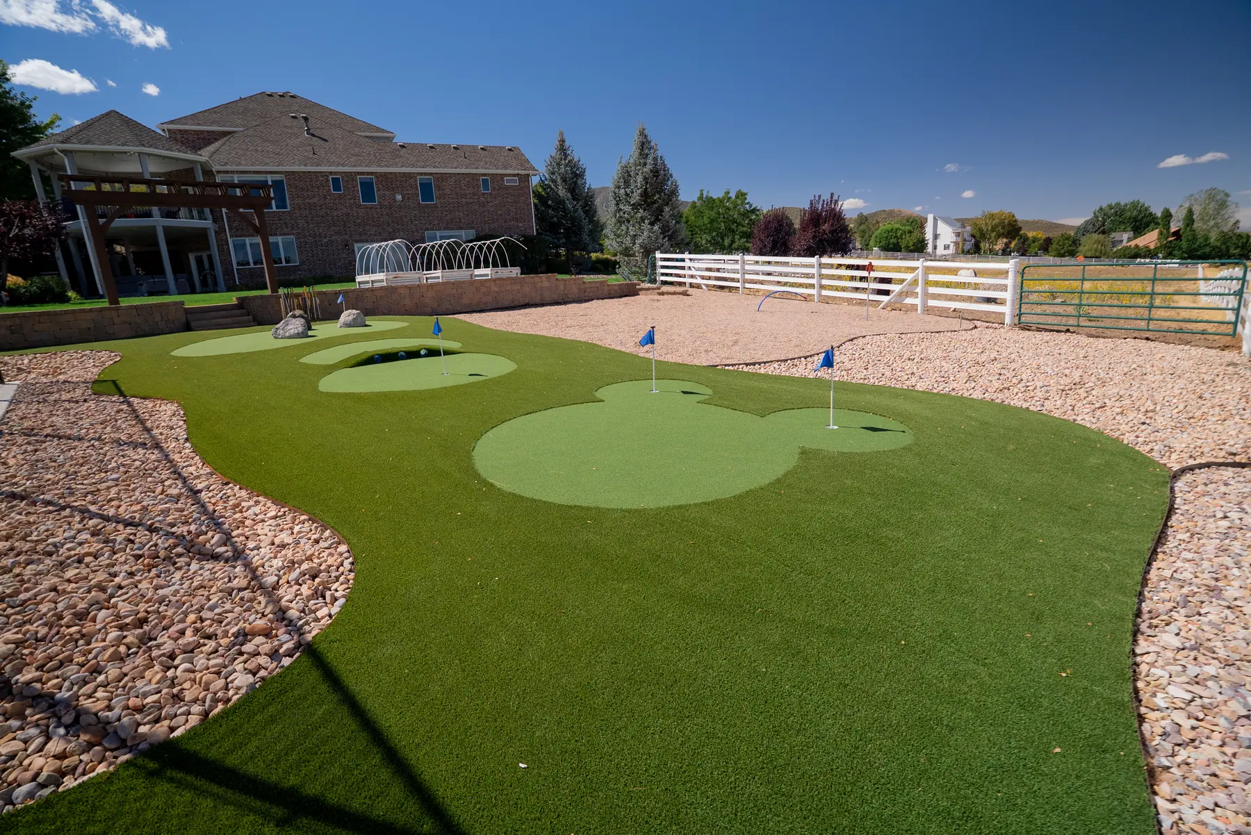 Backyard putting green by J&H Landscaping in Elk Ridge