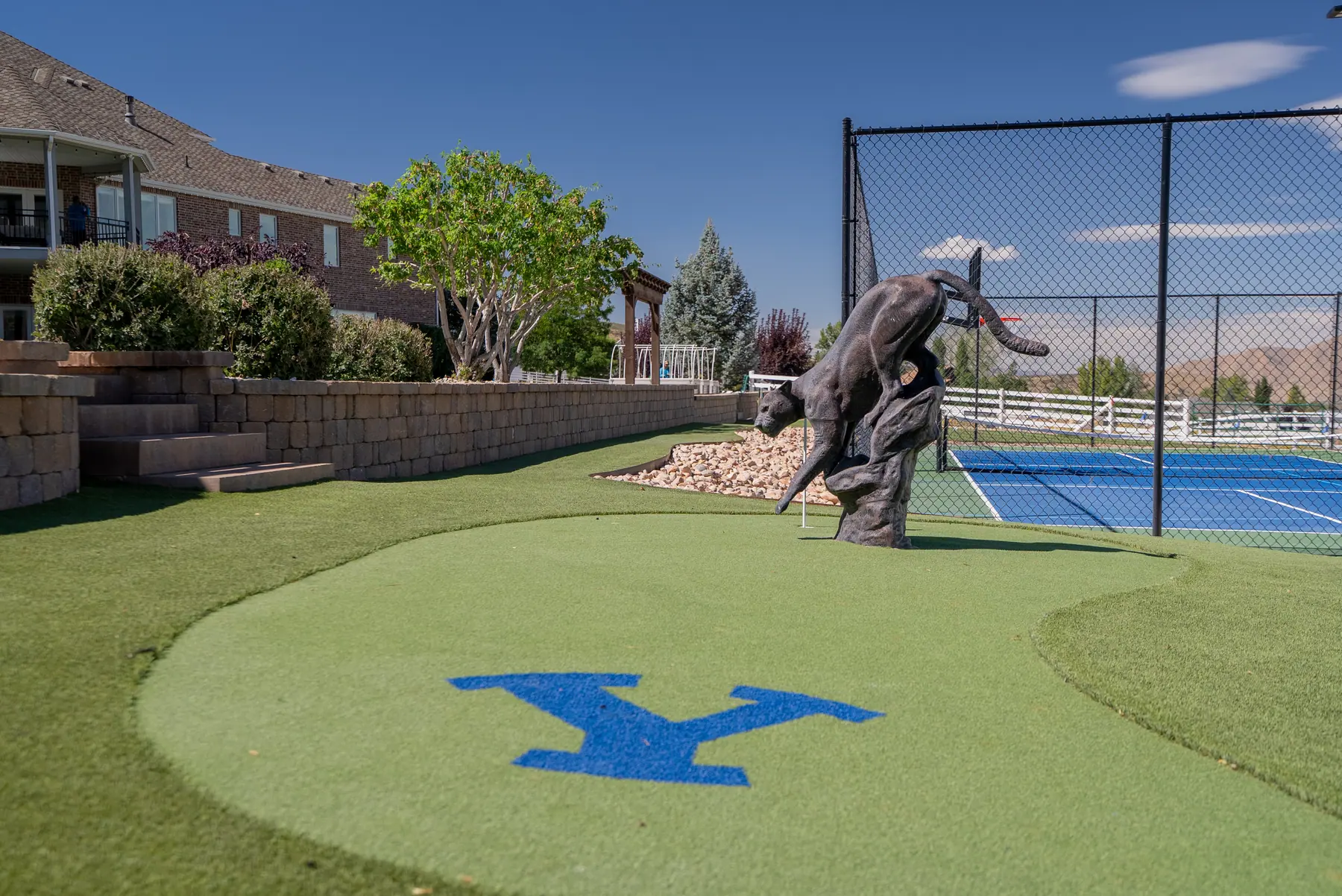 Custom logo putting green by J&H Landscaping in Elk Ridge