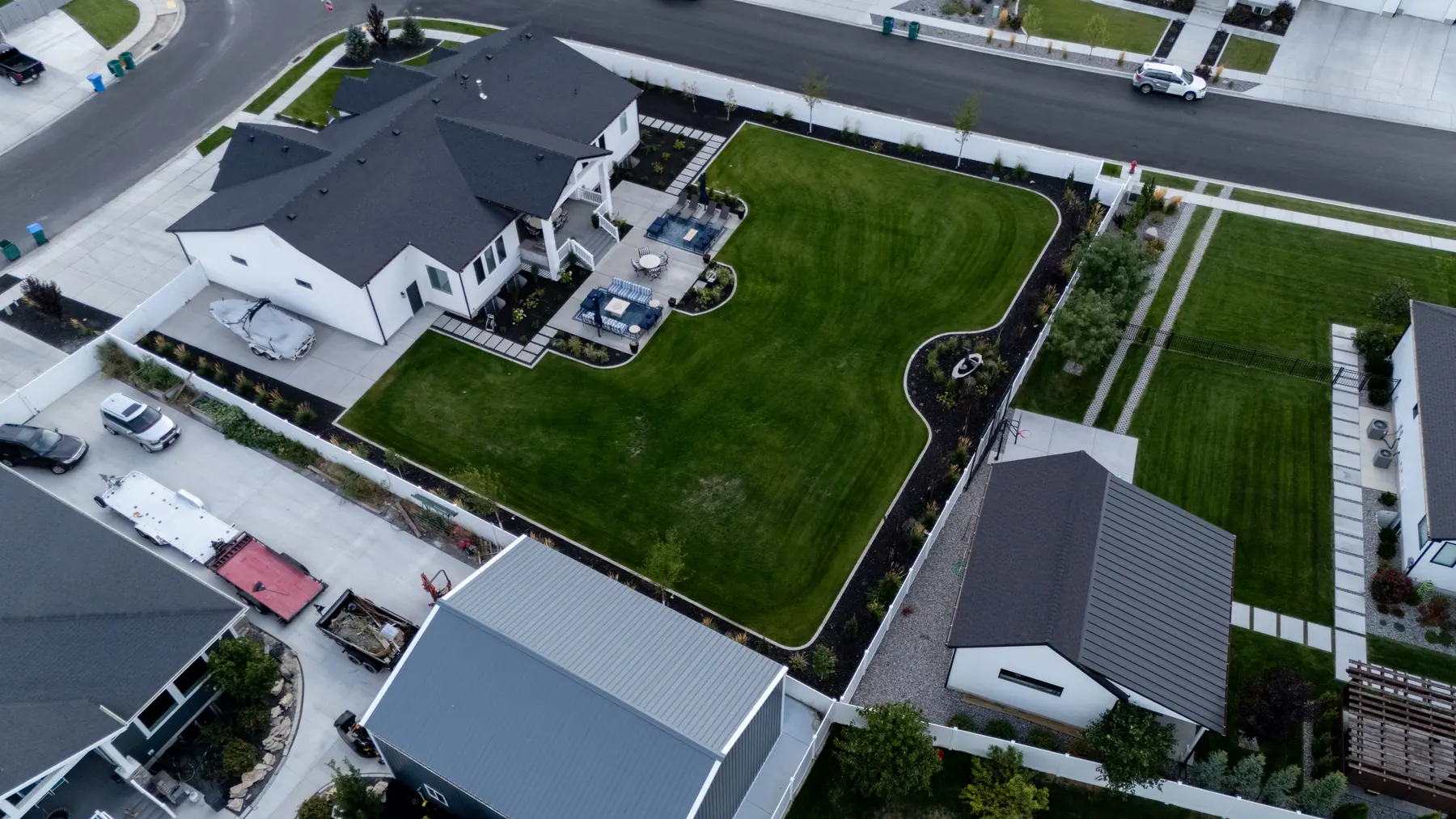 Backyard lawn and patio by J&H Landscaping in Utah County