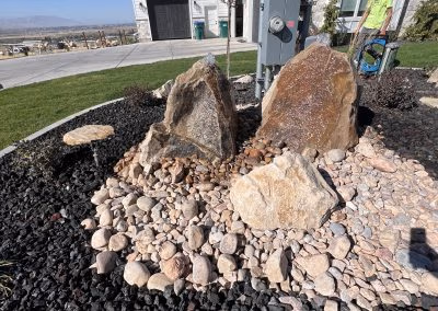 Rock garden featuring large boulders and decorative gravel, showcasing J&H Landscaping's design expertise in Provo, UT.